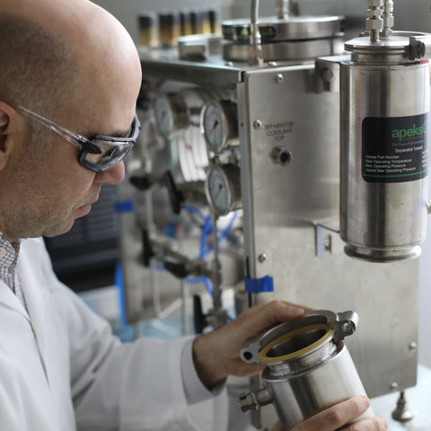 Person in a MYCOfactor  lab setting with Supercritical extraction equipment
